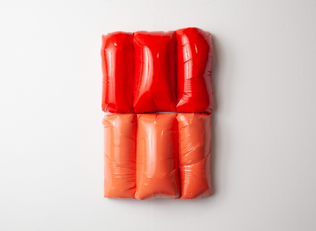 Untitled (red, peach), 2024, a sculpture in plaster, acrylic and polyurethane